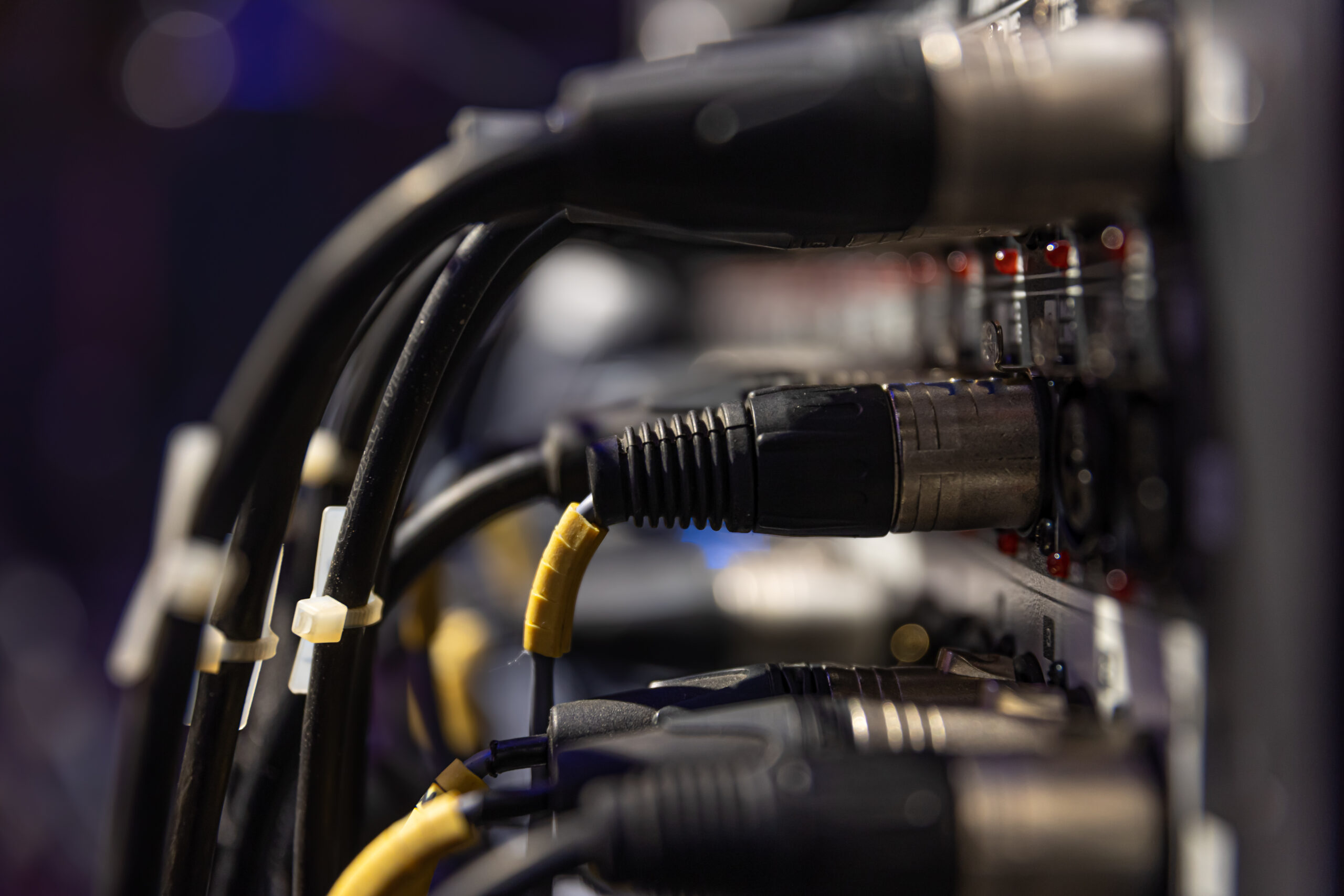 Audio snake and stage box with xlr cables and jacks at a live show.